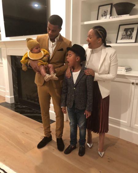 Cory Hardrict and wife Tia Mowry pose a picture with thier children.
